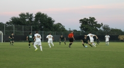 Image of UMBC's Retrievers and Loyala's Greyhound's soccer players in mid game.