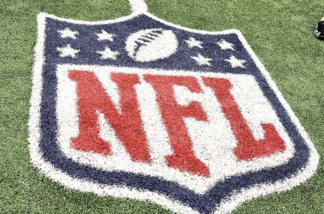 NFL Logo printed on turf on a football fied